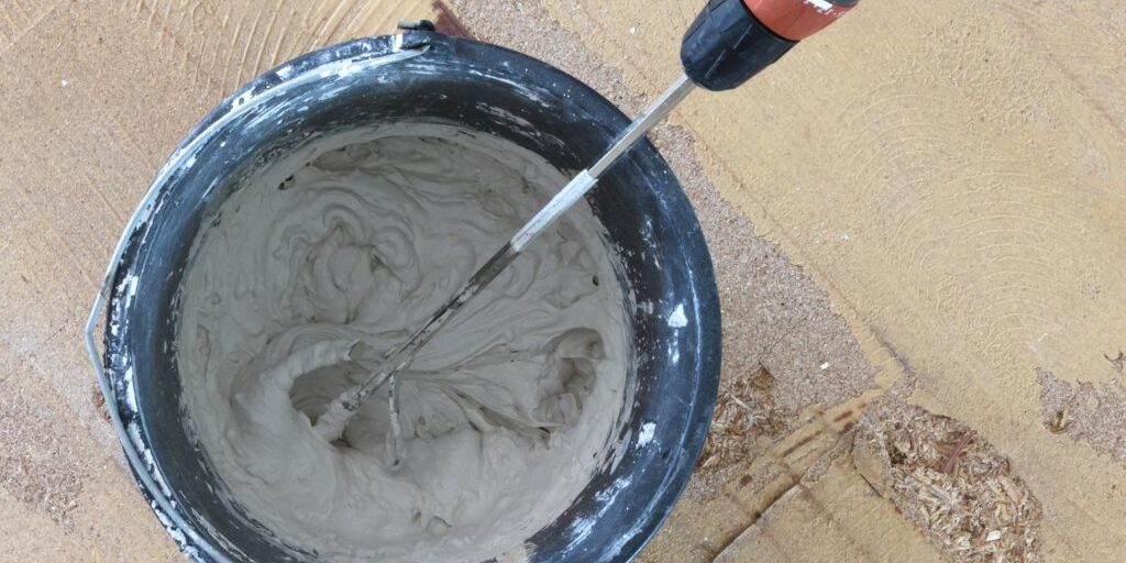 worker mixing the epoxy